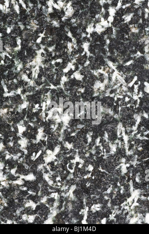 Polished granite surface with black, gray and white elements. Stock Photo