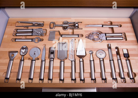 Various kitchen tools in organized kitchen drawer Stock Photo