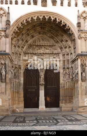 Entrance to church with ornate sculpture in Cathedral Doorway Augsburg Bavaria Germany Stock Photo