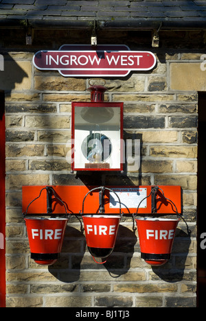 Fire buckets hanging up at Ingrow West station, on the Keighley & Worth Valley Railway Line, Keighley, West Yorkshire, England U Stock Photo