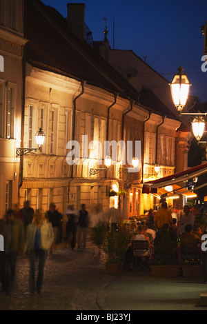 People Walking Along Pilies Gatve At Dusk, Vilnius, Lithuania, Baltic States, Eastern Europe Stock Photo