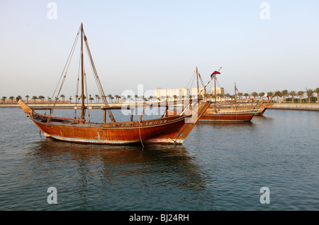 Various types of traditional Arab dhow moored off Doha Corniche. Stock Photo