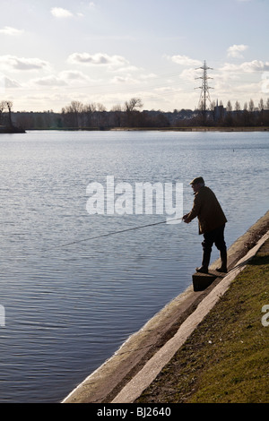 Fly fisherman at Walthamstow reservoirs London England. Stock Photo