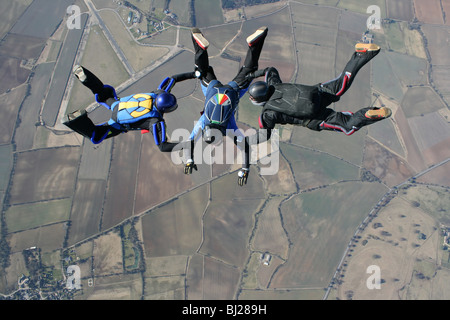 Three skydivers in freefall