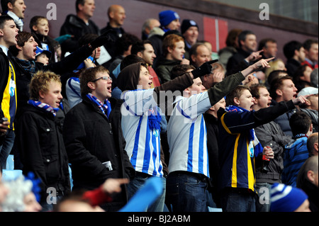Football fans chanting at at match