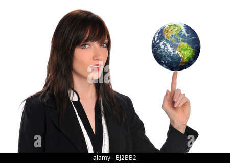 Young businesswoman balancing the earth isolated on a white background Stock Photo
