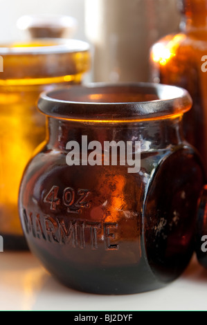 Old marmite jar with other glass bottles