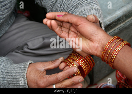 Woman wearing bracelets hi-res stock photography and images - Alamy