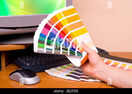 Designer at work. Color samples on table. Stock Photo