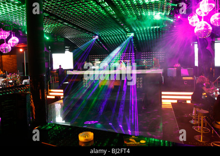 People dancing in Praterdome, Disco in Vienna, Austria. Disco lights, Laser show and smoke fog. Nightlife shot Stock Photo