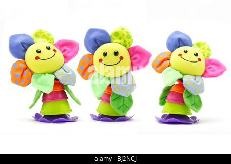 Three sunflower smiley face dolls on white background Stock Photo