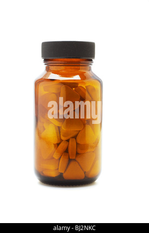 close up of medicine bottle with triangular shape tablets inside on white Stock Photo