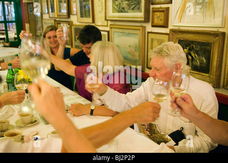 Senior couple celebration with family and friends in a resturant. HOMER SYKES Stock Photo