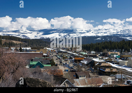 Aerial view of historic downtown Truckee, California, United States of America with snow capped mountains and railroad. Stock Photo