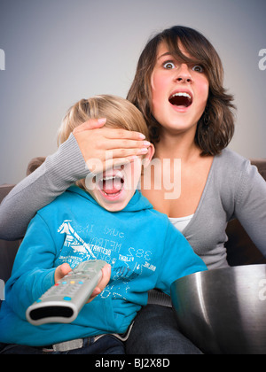 Brother and sister watching tv Stock Photo - Alamy