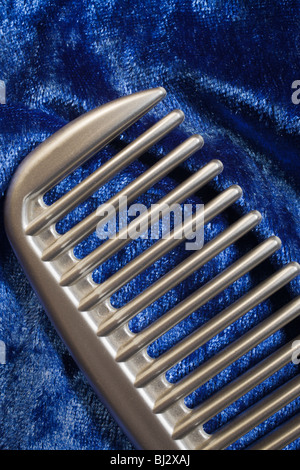 Plastic silver hair comb, abstract. Stock Photo
