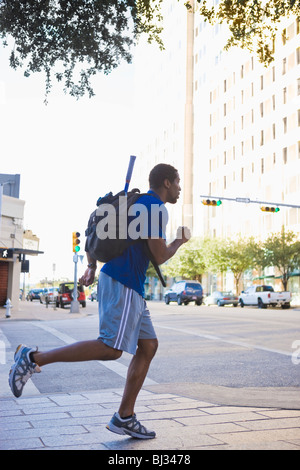 man running in urban setting Stock Photo