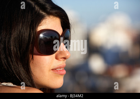 young hispanic latin woman thoughtfully looking out over city buenos aires argentina Stock Photo