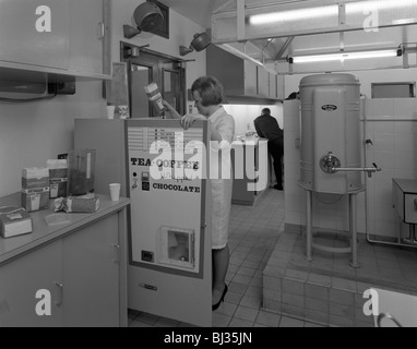 Loading a drinks vending machine at an experimental kitchen in Sheffield, South Yorkshire, 1966. Artist: Michael Walters Stock Photo