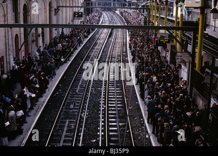 During the evening rush hour, hundreds of rail commuters wait for delayed Thameslink trains during industrial action. Stock Photo