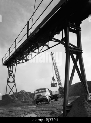 Loading a Ford Thames Trader tipper lorry, Finningley, near Doncaster, South Yorkshire, 1966. Artist: Michael Walters Stock Photo