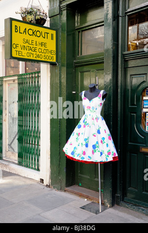 Vintage 1950's dress on stand in street outside Blackout  II vintage clothes shop Covent Garden London England Britain UK Stock Photo