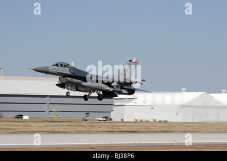 An F-16C from the 457th fighter squadron takes off from NAS Fort Worth Joint Reserve Base in Texas. Stock Photo