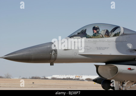 An F-16C from the 457th fighter squadron leaves the disarming pad at NAS Fort Worth Joint Reserve Base in Texas. Stock Photo