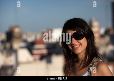 young hispanic latin woman wearing sunglasses smiling to camera buenos aires argentina Stock Photo