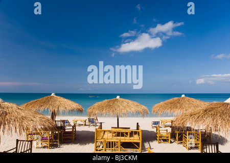 Straw beach umbrellas, beach restaurant, Klong Nin Beach, Ko Lanta or Koh Lanta island, Krabi, Thailand, Asia Stock Photo