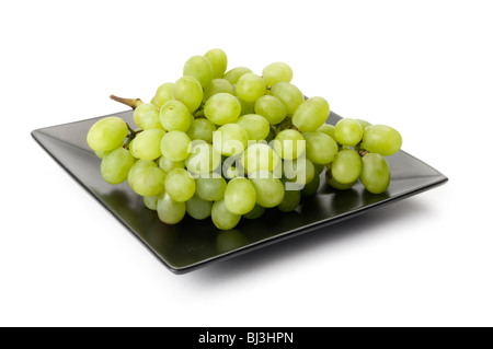 green grapes on black plate Stock Photo