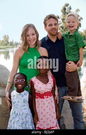ethnic multi racial racially diverse multicultural multi cultural Young couple with son adoption West African siblings looking at camera MR  © Myrleen Pearson Stock Photo