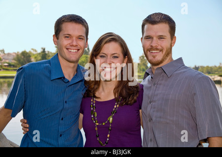 young Adult sister and brothers happily pose for the camera.  MR  © Myrleen Pearson Stock Photo