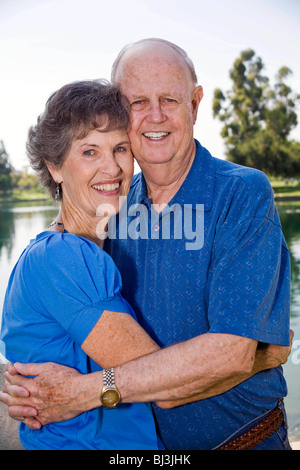 Happy Senior Married couple older elderly people person 70 -80 hugging closely linked  content contentment contented United States MR  © Myrleen Pearson Stock Photo