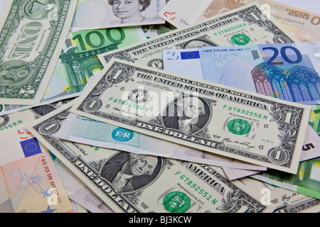 A mixture of bank notes, U.S. dollars, euros and British pounds Stock Photo