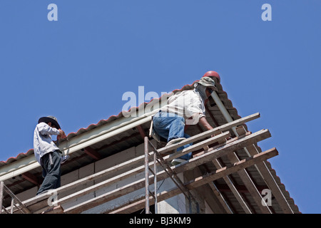 Two Thai construction workers on a scaffold, Thailand, Asia Stock Photo