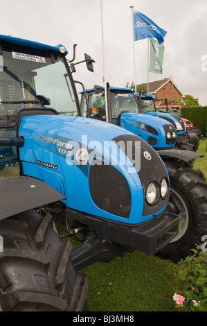 New blue Landini tractors parked & for sale on trade stand display (agricultural machinery & vehicles) - The Great Yorkshire Show, England, GB, UK. Stock Photo