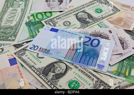 A mixture of bank notes, U.S. dollars, euros and British pounds Stock Photo