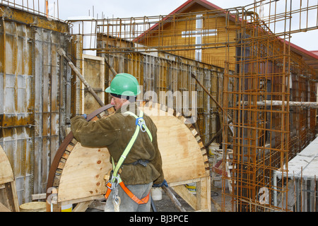 Construction worker with arched window stencils, Adoratrice Monastery, Puerto Montt, Chile, South America Stock Photo