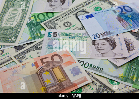 A mixture of bank notes, U.S. dollars, euros and British pounds Stock Photo