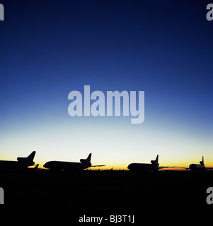 Fading, graduated light of the arid Sonoran desert shows the remains of commercial airliners at the storage facility at Mojave. Stock Photo