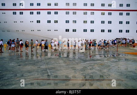 American passengers re-join their cruise ship holiday voyage around the Gulf of Mexico during a day's stop-over in Cancun.