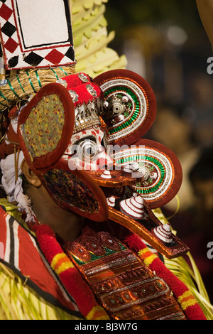 India, Kerala, Cannanore (Kannur), Theyyam, ancient pre Hindu folk art ritual, Agni-Ghandakaran, in final stages of preparation Stock Photo