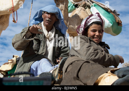 Nomad Bedouins of Sinai peninsula in Egypt on a camel Safari in Jebel Gunah area Stock Photo