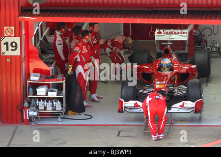 Fernando Alonso of the 2010 Ferrari team in the team garage at the circuit in Montmelo, Barcelona, Spain Stock Photo
