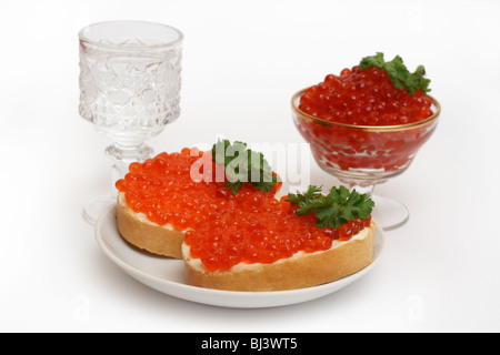 vodka and red caviar on white background Stock Photo
