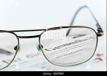 The headline Gesundheit, health seen through glasses Stock Photo