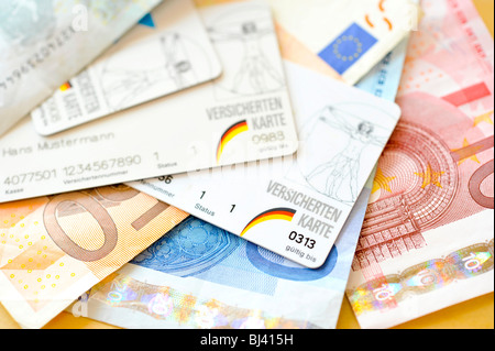 Health insurance cards and Euro bills Stock Photo