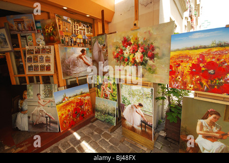 Display of paintings outside gallery near Place du Tertre Montmartre Paris France Stock Photo