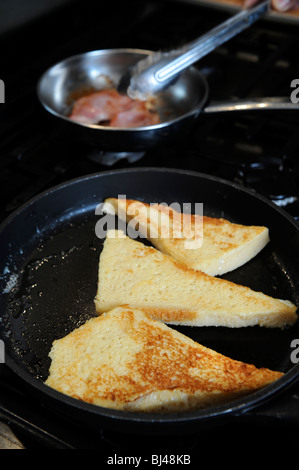 French toast or eggy bread frying in a pan Stock Photo
